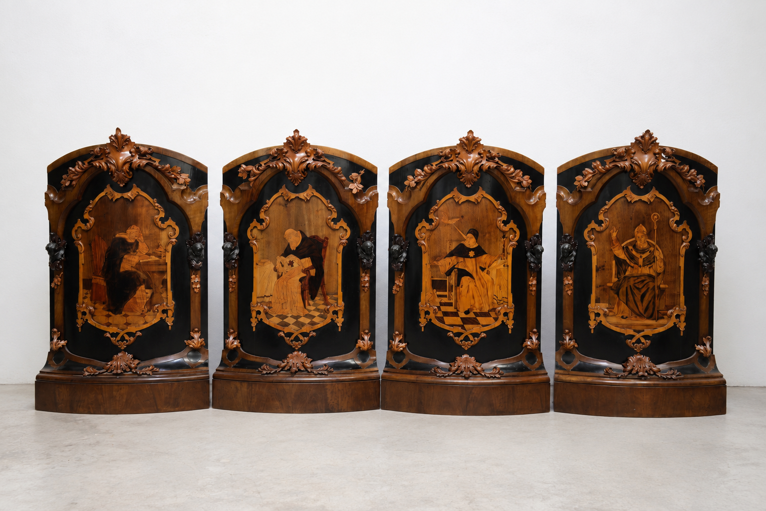 The four main panels of the predella.